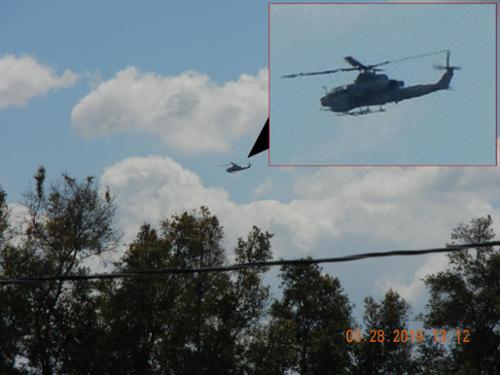 On March 28, 2019 this fully armed AH-1 Viper military battlefield helicopter was spotted patrolling the area. It is seen here flying over the Marian Rudnyk's back yard after having overflown his house! [(c)2017MarianRudnyk. All Rights Reserved.]