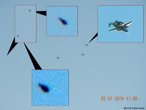 On 2-7-2019 three Northrop Grumman Hawkeye all-weather, carrier-capable tactical airborne early warning (AEW) naval aircraft. Two UFOs appeared high in the sky, then in a single burst were behind the Hawkeyes, a split second later they burst vertically up & were gone.  

(c)2019MarianRudnyk