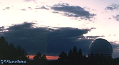 As the sun set & I prepared for another asteroid hunting observing run in 1985, I snapped this wonderful photo of the Palomar Observatory 200" telescope. Fortunately the clouds seen here cleared and the mountain provided sparkling clear skies. 
(c)1985/2021MarianRudnyk.