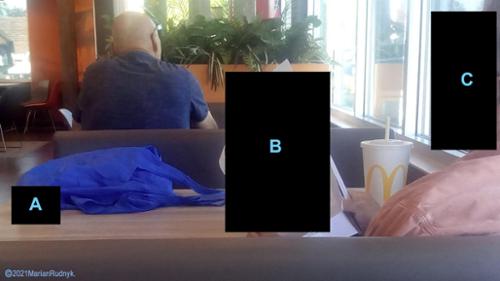 The MIP listened intently as we talked - I managed to slyly get this pic. I then boldly & firmly exclaimed, "ETs are real". He turned & squarely faced us. I then added, "And MIBs. MIBs are goons". At that point he got up & angrily proclaimed "That's B######T!" & hastily left...

(c)2019MarianRudnyk