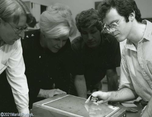 Here I am huddled around a light box pointing out my latest discovery to fellow astronomers at JPL-NASA. Laying on the light box is a square glass plate photograph I took on the Palomar 48" Schmidt telescope.

(c)2021MarianRudnyk
